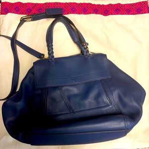 Tory Burch bag. Navy Blue leather . Never used . Comes with dust bag .